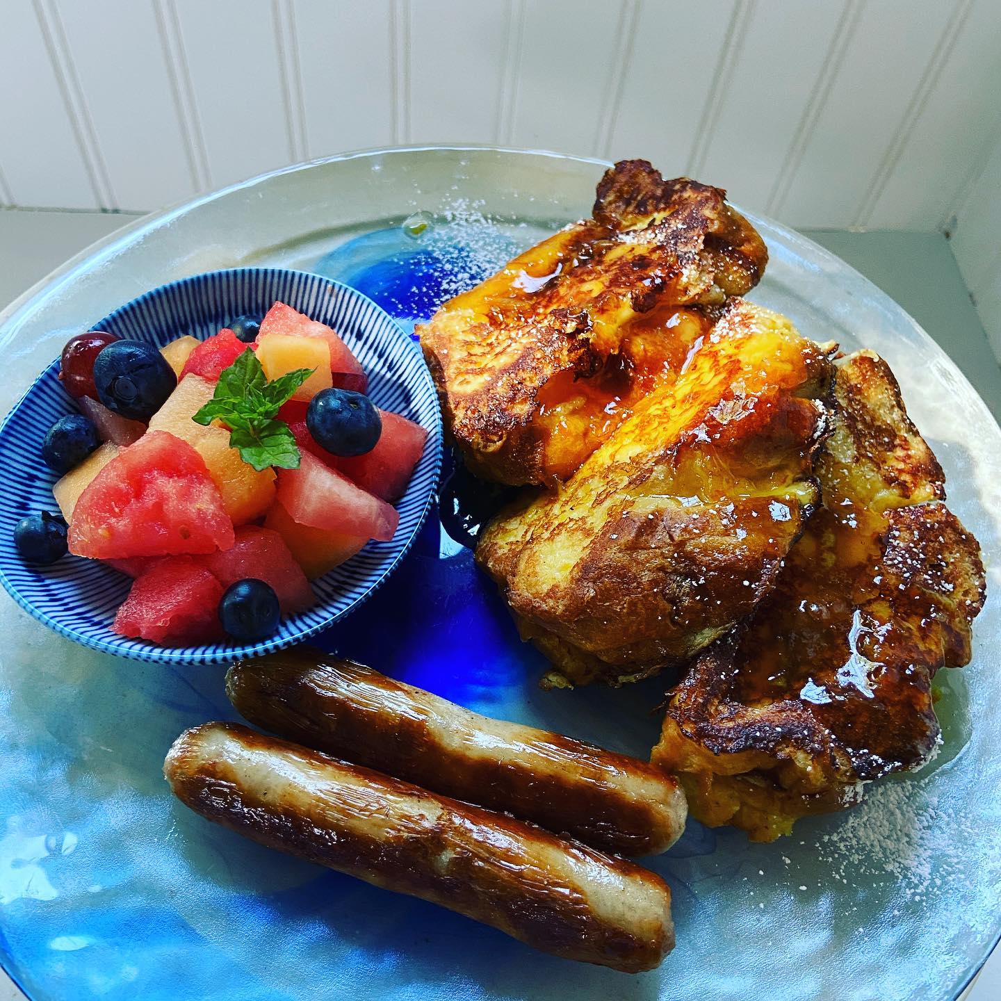Orange glazed challah French toast with good sausages.